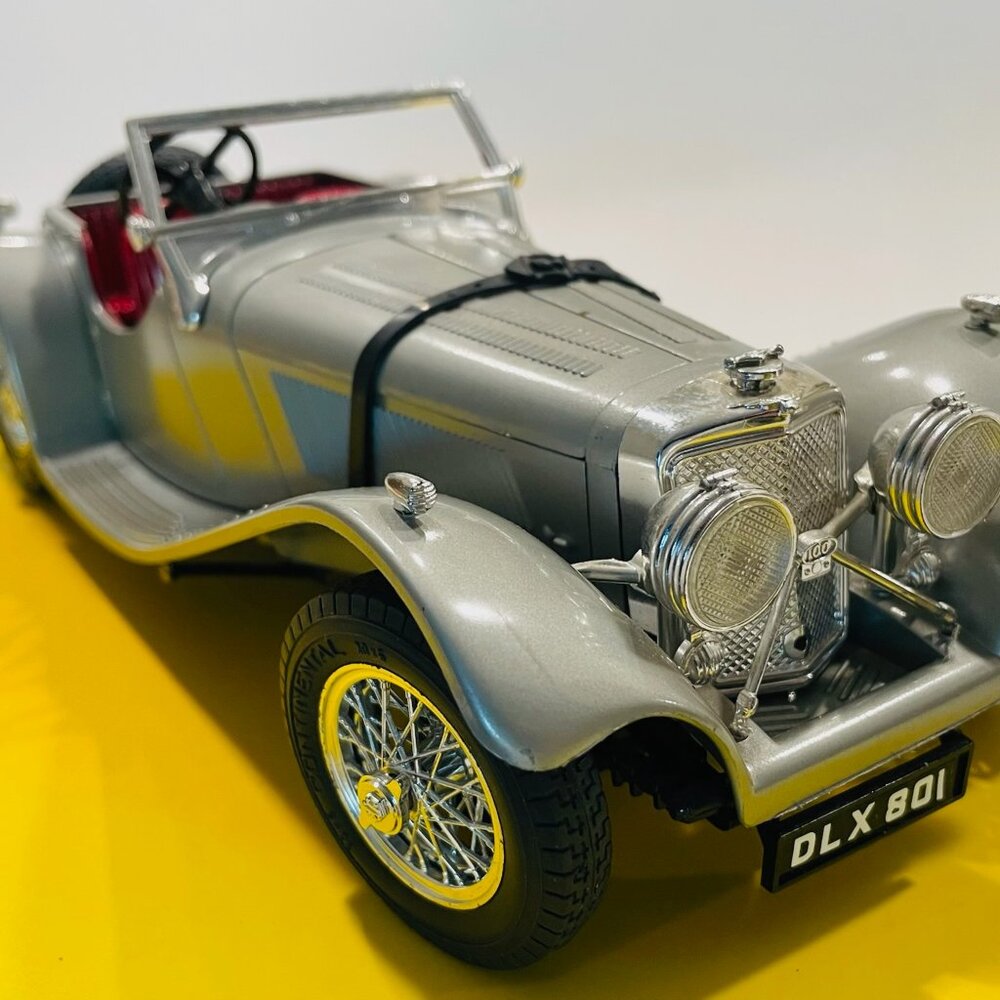 A Jaguar Model 1937 Burago Made In Italy Silver With Red Interior